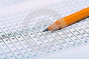 A pencil sitting on a test bubble sheet