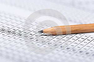 A pencil sitting on a test bubble sheet