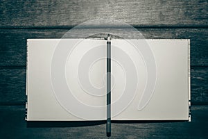 Pencil on small notepad blank for your text