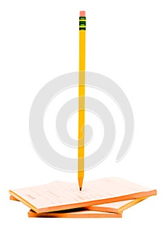Pencil with stack of notepads