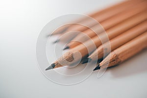 Pencil standing out from others unique leadership concept