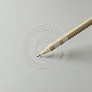 A pencil on white paper close up.