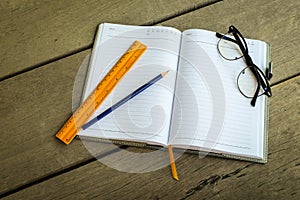 Pencil, yellow ruler for blank notebook write your note and gl
