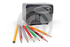 Pencils against of desk electric pencil sharpener in selective focus