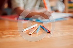 Pencils, crayons and pens on a table for creative drawing, artwork and art education in a classroom at school. Coloring