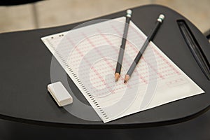 Pencils and eraser put on Optical mark recognition sheet in examination room