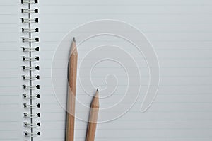 Pencils On The Lined Paper of Wirebound Notebook.