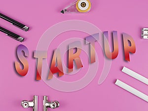 Pencils and a pencil sharpener on the pink background. Word STARTUP