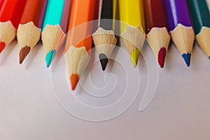 Pencils rainbow color on a line. Macro top.