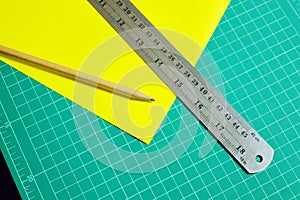 Pencils, rulers, yellow paper