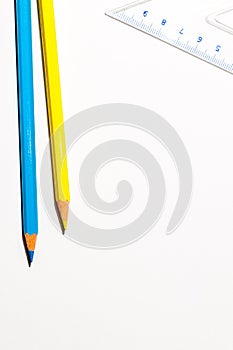 Pencils And A Ruller Over White Paper