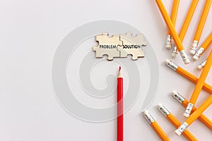 Pencils with the text problem and solution over white background