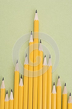 Pencils in uneven row.
