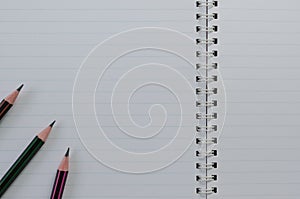 Pencils On Wirebound Notebook Open with Lined Paper.