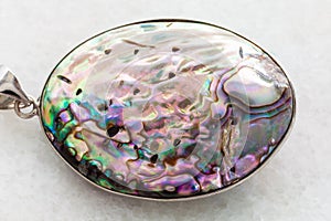 pendant from Abalone (haliotis) shell on white