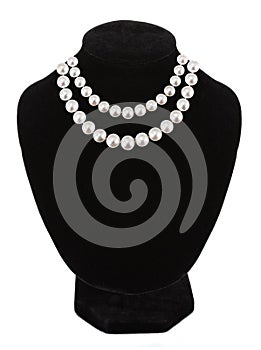 Pendant with gem stones pearls on black mannequin isolated on white