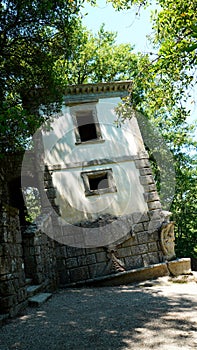 PENDANT HOUSE among the plants in the sacred wood of Bomarzo. a natural park adorned with numerous basalt sculptures, inaugurated