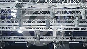 Pendant lights ensure play of light on ice arena floor