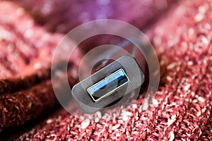 Pendriver usb on red wool cloth background