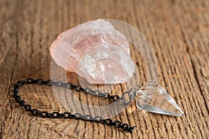 The pendulum on a chain with a natural crystal