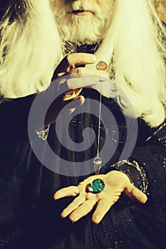 Pendulum in hands of wizard