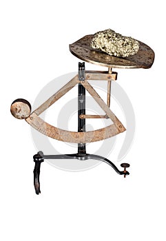 Pendulum scales with a gold nugget ore