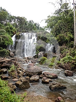 Penembang waterfall is rarely known by people in the middle of oil palm plantations