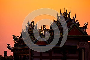 Penghu island Pescadores Taiwan October 14, 2019   Silhouette of the traditional roof of a Chinese temple at sunset