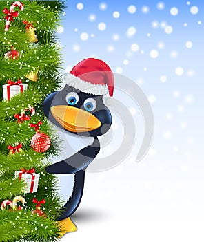 Penguin behind christmas tree