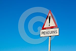 Penguin sign with a blue sky in the background. South Africa.