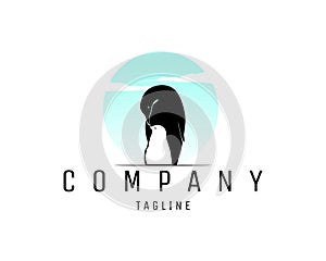 penguin silhouette logo with mother and child view isolated white background.