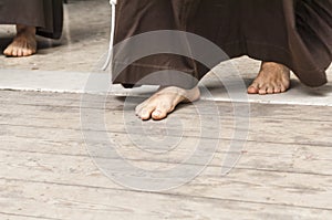 Penitent with bare feet