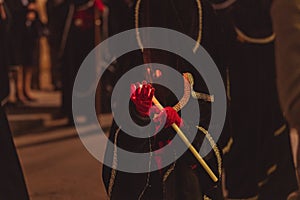 Penitent holding a lighted candle photo