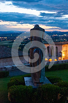 The Penitent knight statue in Assisi at sunset