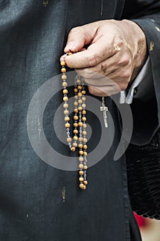 Penitent praying the rosary photo