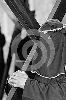 Penitents in a Via Crucis with crosses in Lorca photo