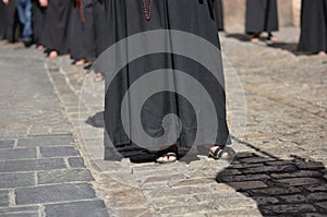 Penitents with the rosary, parade in the streets of the cities photo