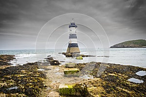 Penmon lighthouse sits at the start of the Menai Strait across from Puffin Island