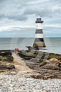 The Penmon point lighthouse is located close to Puffin Island on Anglesey, Wales - United Kingdom