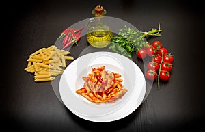 Penne with arrabbiata sauce and fresh ingredients