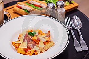 Penne bolognese pastea with sandwitches and coffee