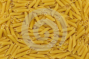 Penne italian pasta as background