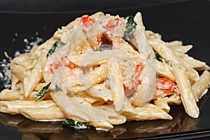 Penne Pasta. Pasta with grilled shrimp marinara sauce, Parmesan cheese and fresh Italian parsley