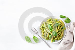 Penne pasta with spinach basil pesto sauce
