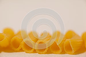 Pennette pasta on white background