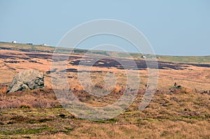 Pennine landscape with large old boulder or standing stone on midgley moor in calderdale west yorkshire