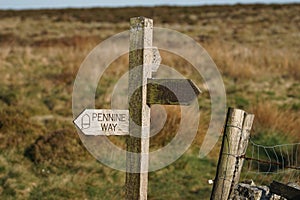 The Pennine Way footpath sign near Pinhaw Beacon Trig Point, Elslack Moor near Lothersdale, North Yorkshire. England, UK