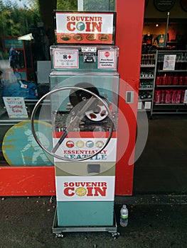 Penny pressing machine Essentially Seattle in front of store