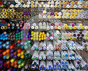 Pens, Markers by Colors and Sizes Arranged by Cells in the Stationery Store. A Variety of Professional Supplies for Artists and