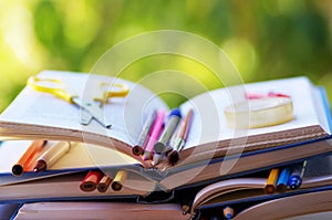 pens and pencils in books